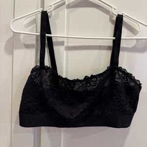 Victoria’s Secret black lace bra, the band has Victoria’s Secret written on it.